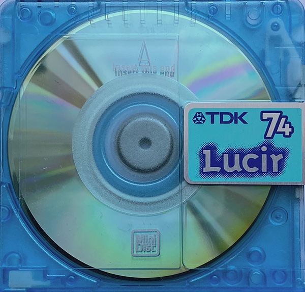Image of a TDK Lucir 74 MiniDisc, transparent light blue-green