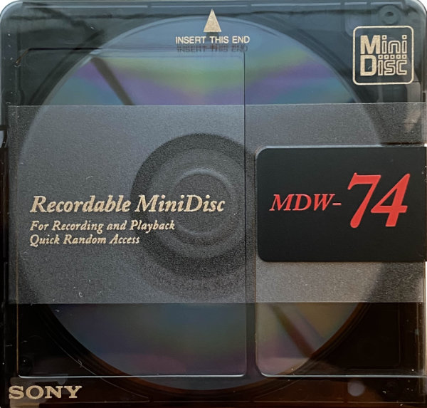 Black Sony MDW-74 minidisc with translucent front and solid black